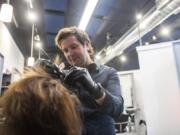 Grant Whitney, owner of Studio V, colors Gina Phillips&#039; hair at his salon in Felida.