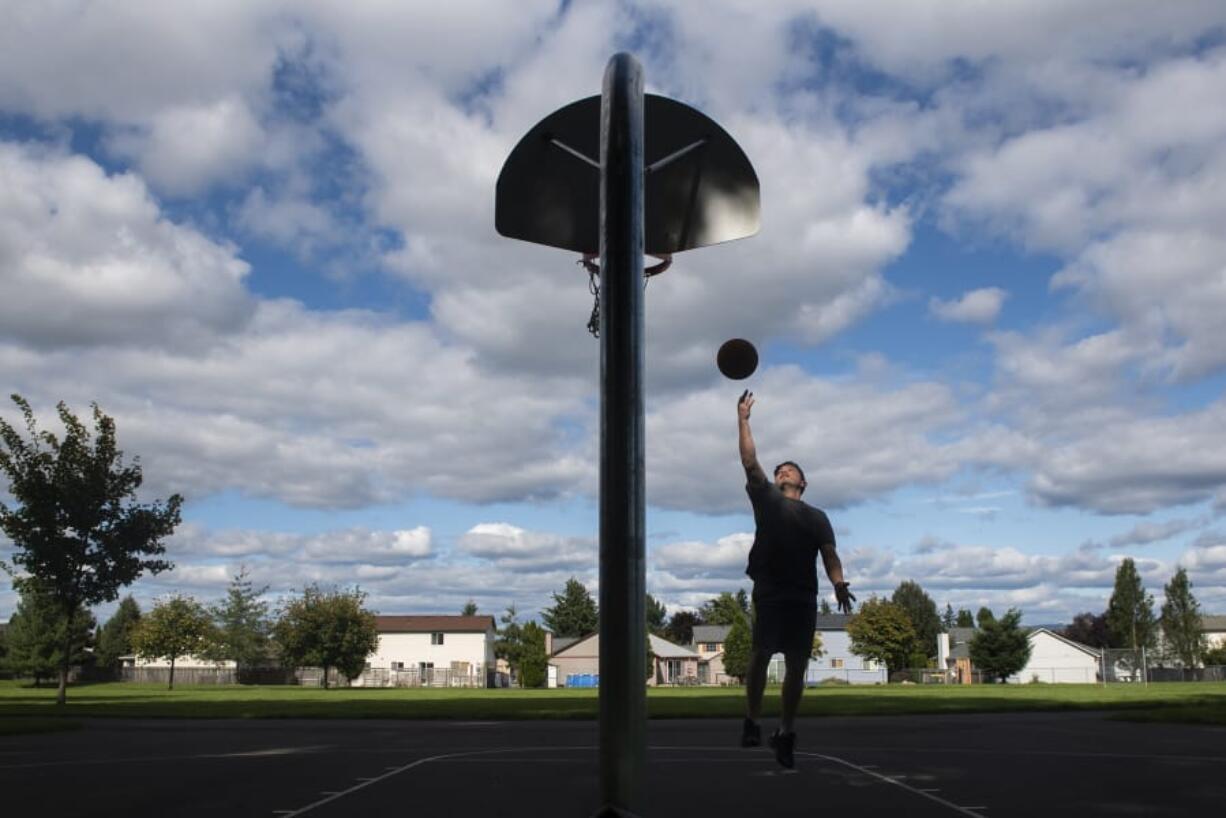 Jason Jaurigui of Vancouver shoots hoops at Fir Garden Park, one of just a handful of parks near the northeastern border of Vancouver. Jaurigui said he visits the park about three times a week.