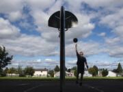 Jason Jaurigui of Vancouver shoots hoops at Fir Garden Park, one of just a handful of parks near the northeastern border of Vancouver. Jaurigui said he visits the park about three times a week.