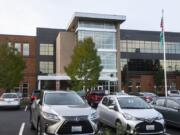 Cars are seen here in the parking lot of Henrietta Lacks Health and Bioscience High School on Monday morning. The magnet high school, located in central Vancouver, opened in 2013.