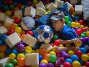 Emmett Elliott, 10, plays in his ball pit at home in Vancouver. Emmett was diagnosed with a rare neurological disorder called Jordan's Syndrome earlier this year. The disorder can cause intellectual delay, hypotonia, or low muscle tone, impaired speech, developmental delays, autism spectrum disorder and seizures.