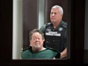 Robert Breck, 80, the suspect in an Oct. 3 fatal shooting at Smith Tower, is wheeled out of the courtroom after making a first appearance in Clark County Superior Court on Friday morning, Oct. 4, 2019.