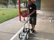 BATTLE GROUND: The local parent teachers organization for Glenwood Heights Primary School worked to beautify the playground recently.