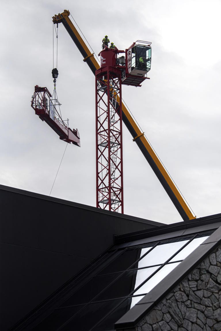 Crews work to assemble a tower crane in downtown Vancouver at the future site of the Aria Apartments on Monday afternoon, Oct. 7, 2019.