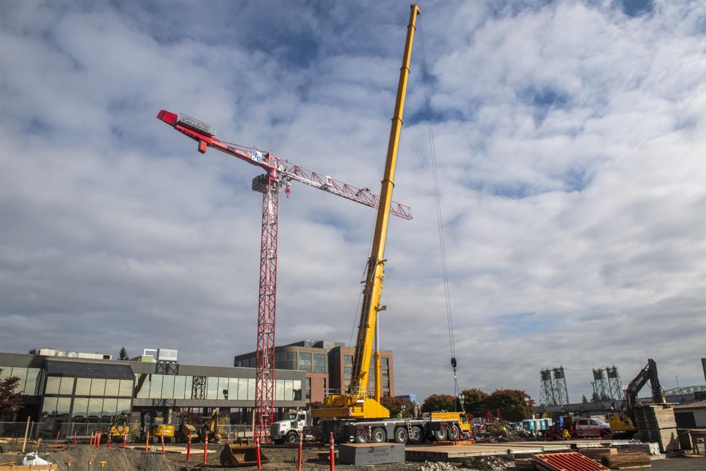 Crews work to assemble a tower crane in downtown Vancouver at the future site of the Aria Apartments on Monday afternoon, Oct. 7, 2019.