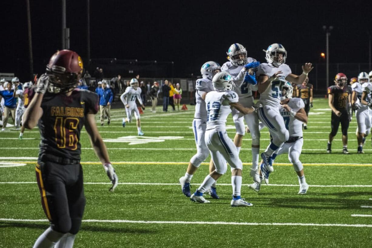 Mountain View celebrates a touchdown with only seconds left in the first half during a game against Prairie at Battle Ground District Stadium Thursday night, Oct. 10, 2019.