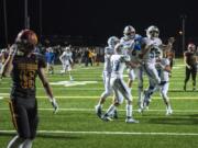 Mountain View celebrates a touchdown with only seconds left in the first half during a game against Prairie at Battle Ground District Stadium Thursday night, Oct. 10, 2019.