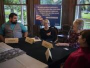 U.S. Sen. Patty Murray, second from left, discusses veterans’ health care issues on Wednesday with military veterans Nate Patterson, from left, Evelyn Brady and Tonya Wark at The Marshall House in Vancouver. Murray was looking for feedback on a new health care system administered by the Department of Veterans Affairs.