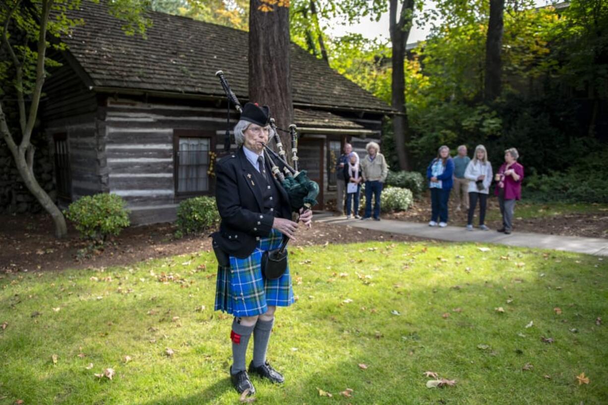 Annette Allen of Vancouver plays the bagpipe as part of a fall festival Sunday afternoon at Covington House in Vancouver.