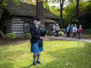 Annette Allen of Vancouver plays the bagpipe as part of a fall festival Sunday afternoon at Covington House in Vancouver.