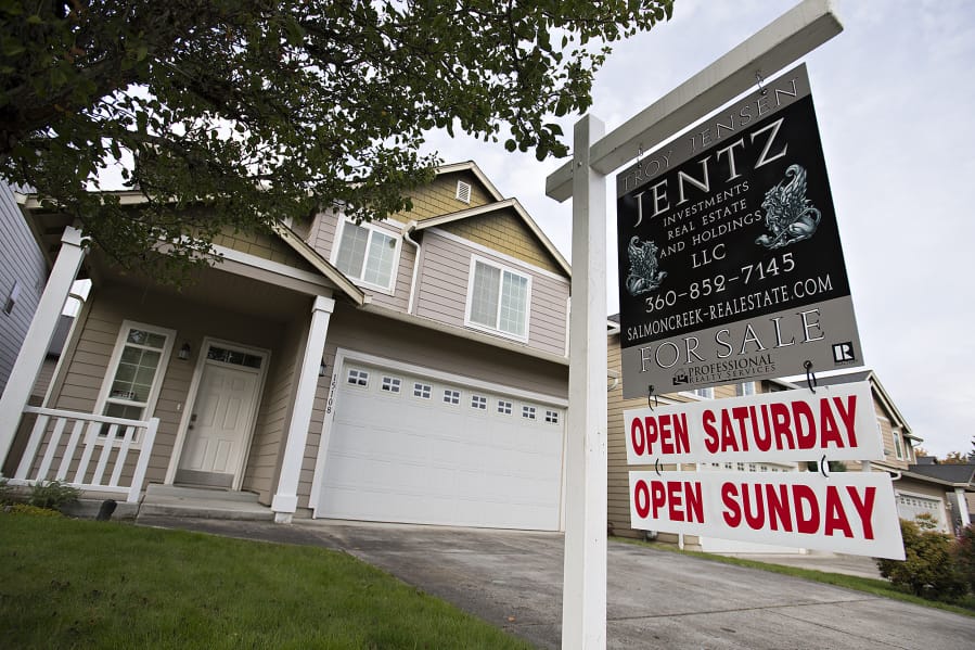 A sign notifies those passing by of a home for sale in Salmon Creek on Tuesday. The latest RMLS report for Clark County shows the housing market slowing down as it enters the winter season, but sales remain higher than at this time last year.