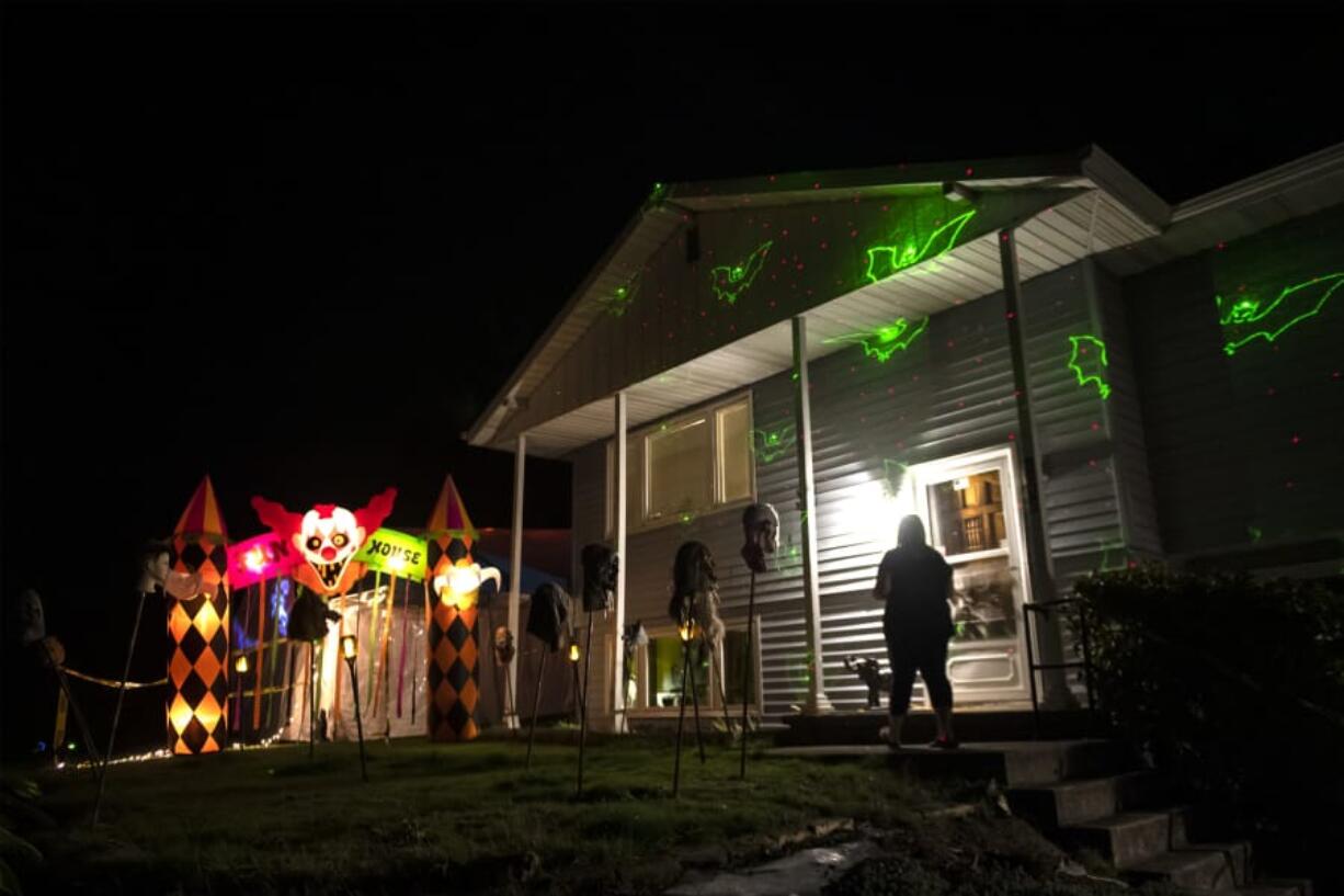 Miranda Jensen walks toward the entrance of the haunted maze she and her mother built next to their home in Ridgefield. The maze is open Oct. 26 and Oct. 31 through Nov. 2, and is free for visitors, although they will accept donations.