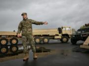 Cmdr. Josh Barrow provides an overview of Bravo Company&#039;s vehicles during an open house at the Armed Forces Reserve Center on Saturday afternoon.