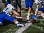 Evergreen’s Tyvauntae Deloney reaches out to try and break the end zone plane during a game against Mountain View  at McKenzie Stadium on Friday night, Oct. 18, 2019.