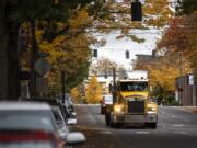 Cars and trucks make their way along Mill Plain Boulevard between Main Street and Broadway on Monday. Road improvements will change that section of the road to make it more accessible to truck traffic, as well as to cyclists and pedestrians.