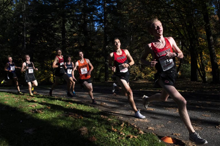 Runners take a turn during the boys 4A district cross country meet at Lewisville Park on Wednesday afternoon, Oct. 23, 2019.