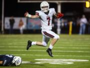 LEAD OPTION-CamasÄô Tyler Forner leaps over SkyviewÄôs Mason Wheeler during a game at the Kiggins Bowl on Thursday night, Oct. 24, 2019.