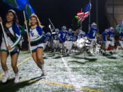 Mountain View runs onto the field before a game against Kelso at McKenzie Stadium on Friday night, Oct. 25, 2019.