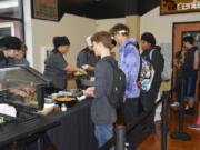 Washougal: Washougal High School culinary arts students Zoie Petersen, left, and Jovanna White serve students during a special lunch at the high school.