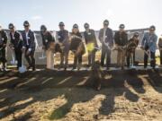 Vancouver Mayor Anne McEnerny-Ogle, Vancouver City Manager Eric Holmes and members of other involved companies break ground on The Columbia at the Waterfront on Wednesday afternoon.