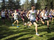 Runners take off from the starting line during the 2A Boys District Cross Country meet at Lewis River Golf Course on Thursday afternoon, Oct. 31, 2019.