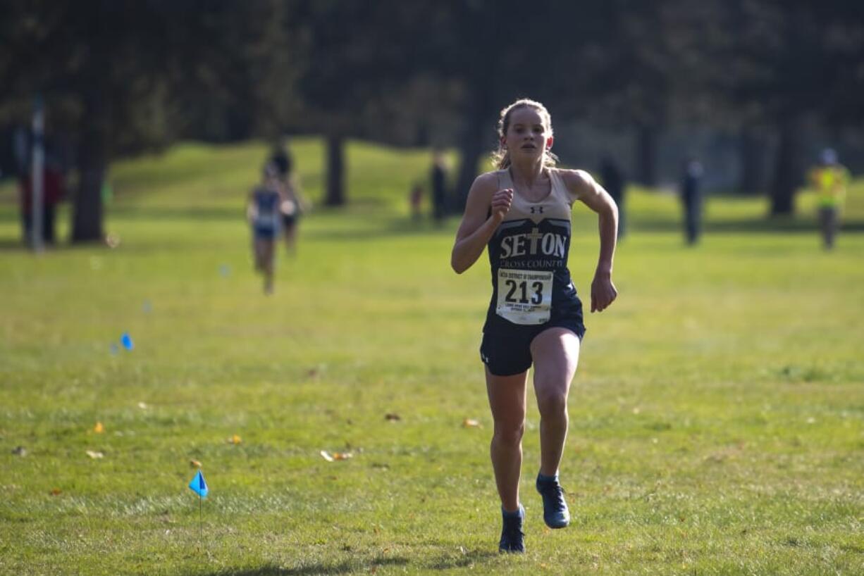 Seton Catholic&#039;s Lara Carrion leads the race shortly before crossing the finish line during the 1A Girls District Cross Country meet at Lewis River Golf Course on Thursday afternoon, Oct. 31, 2019.