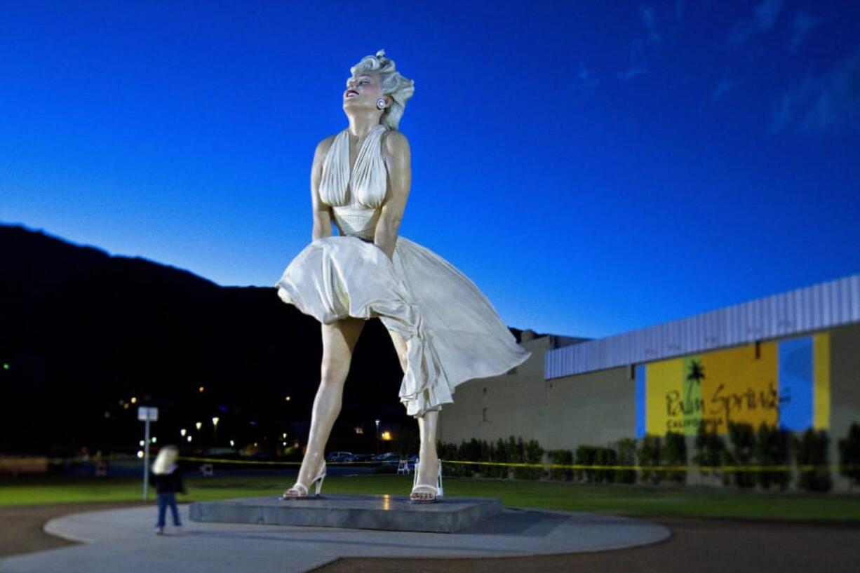 A Marilyn Monroe statue by sculptor Seward Johnson stands 26 feet high with white skirt in midbillow in November 2012 in Palm Springs, Calif.