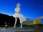 A Marilyn Monroe statue by sculptor Seward Johnson stands 26 feet high with white skirt in midbillow in November 2012 in Palm Springs, Calif.