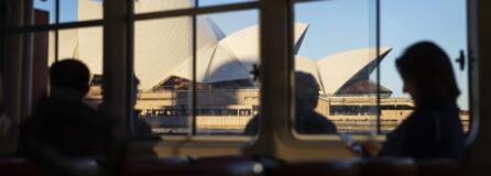 Ferry passengers sail past the Sydney Opera House in Sydney, Australia. The opera house came in more than 1,300 percent over budget, but has become one of the world's most recognizable structures.