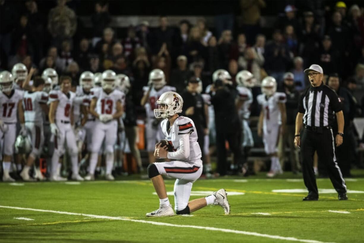 Camas quarterback Blake Ascuitto takes a knee to secure the Papermakers 21-17 victory over the Skyview Storm at Kiggins Bowl on Thursday.