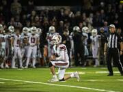 Camas quarterback Blake Ascuitto takes a knee to secure the Papermakers 21-17 victory over the Skyview Storm at Kiggins Bowl on Thursday.