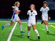 Mountian View&#039;s Kylie Ellett celebrates her goal in the first half of Tuesday&#039;s match against Kelso. Mountain View won 2-1 in overtime to wrap up the 3A Greater St. Helens League title.