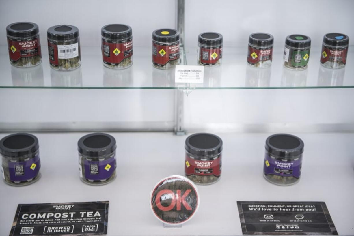 Marijuana packaged in glass jars is on display July 15 at a state-licensed recreational cannabis retail shop.