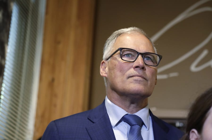 Washington Gov. Jay Inslee listens during a news conference Aug. 22 in Seattle.