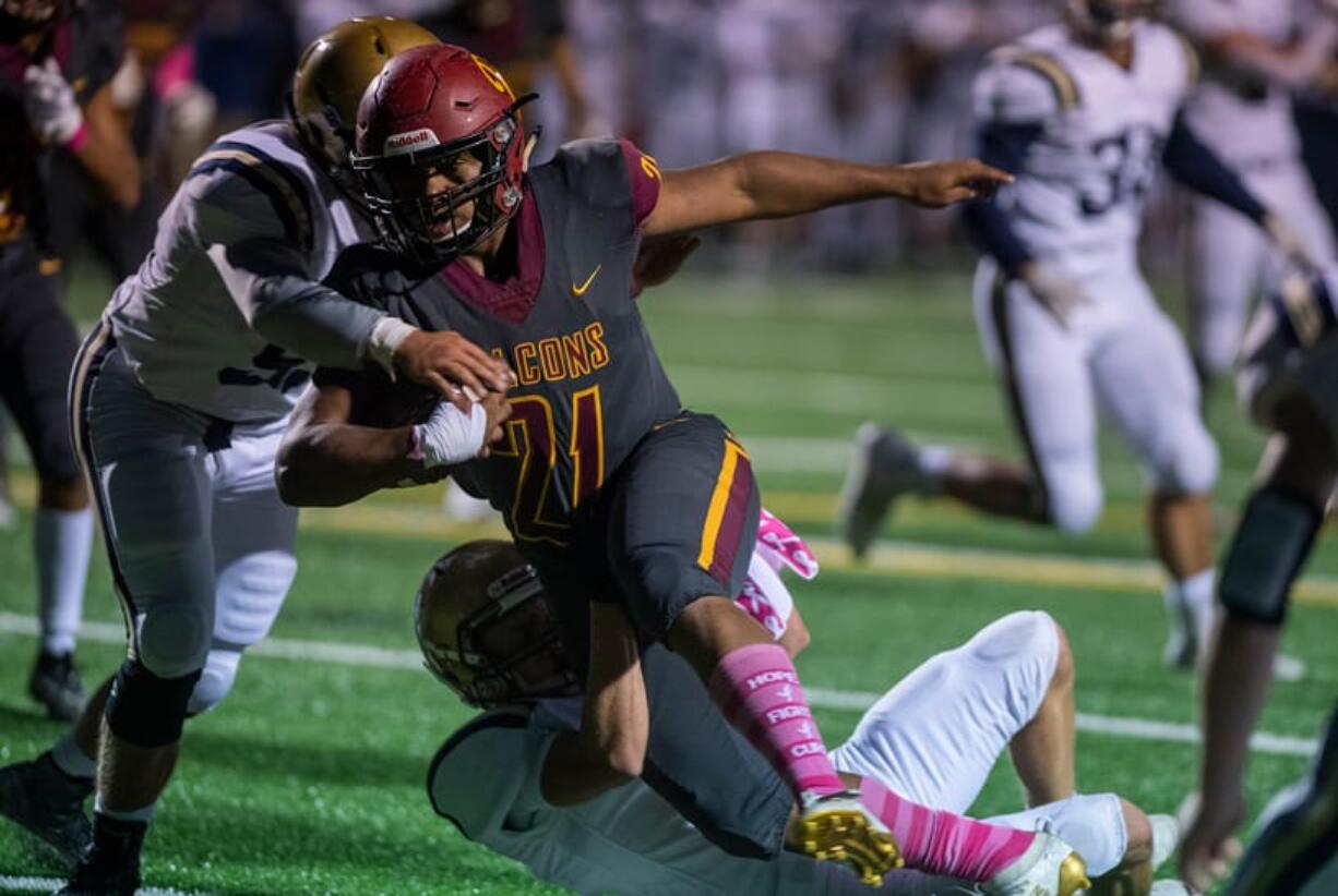 Prairie's Devante Clayton (21) scores the first touchdown of the night during Friday night's football game against Kelso at District Stadium in Battle Ground on Oct. 4, 2019. Prairie won 38-22.