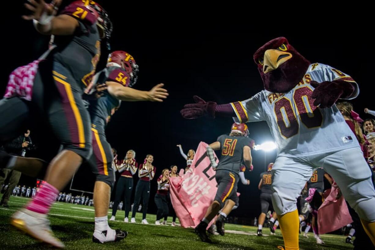 Prairie runs onto the field after halftime during Friday night's game at District Stadium in Battle Ground on Oct. 4, 2019. Prairie won 38-22.