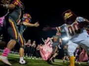 Prairie runs onto the field after halftime during Friday night's game at District Stadium in Battle Ground on Oct. 4, 2019. Prairie won 38-22.