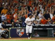 Houston Astros' Jose Altuve watches his two-run walk-off to win Game 6 of baseball's American League Championship Series against the New York Yankees Saturday, Oct. 19, 2019, in Houston. The Astros won 6-4 to win the series 4-2.