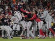 The Washington Nationals celebrate after Game 7 of the baseball World Series against the Houston Astros Wednesday, Oct. 30, 2019, in Houston. The Nationals won 6-2 to win the series. (AP Photo/David J.