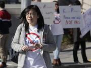 In this photo taken Oct. 11, 2019, Linda Yang, of the &#039;Let People Vote&#039; campaign, is seen at a demonstration against I-1000, in Bellevue, Wash. More than two decades after Washington voters banned affirmative action, the question of whether one&#039;s minority status should be considered as a contributing factor in state employment, contracting and admission to public colleges and universities is back on the ballot. The Nov. 5 vote comes months after the Legislature approved Initiative 1000 in April, on the final day of this year&#039;s legislative session. Opponents of the measure collected enough signatures to force a referendum, Referendum 88, and now voters will have the final say on whether I-1000 should become law.