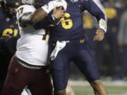 Arizona State&#039;s George Lea, left, tackles California quarterback Devon Modster (6) in the first half of an NCAA college football game, Friday, Sept. 27, 2019, in Berkeley, Calif.