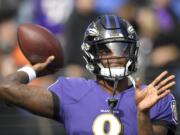 Baltimore Ravens quarterback Lamar Jackson works out prior to an NFL football game against the Cincinnati Bengals Sunday, Oct. 13, 2019, in Baltimore.