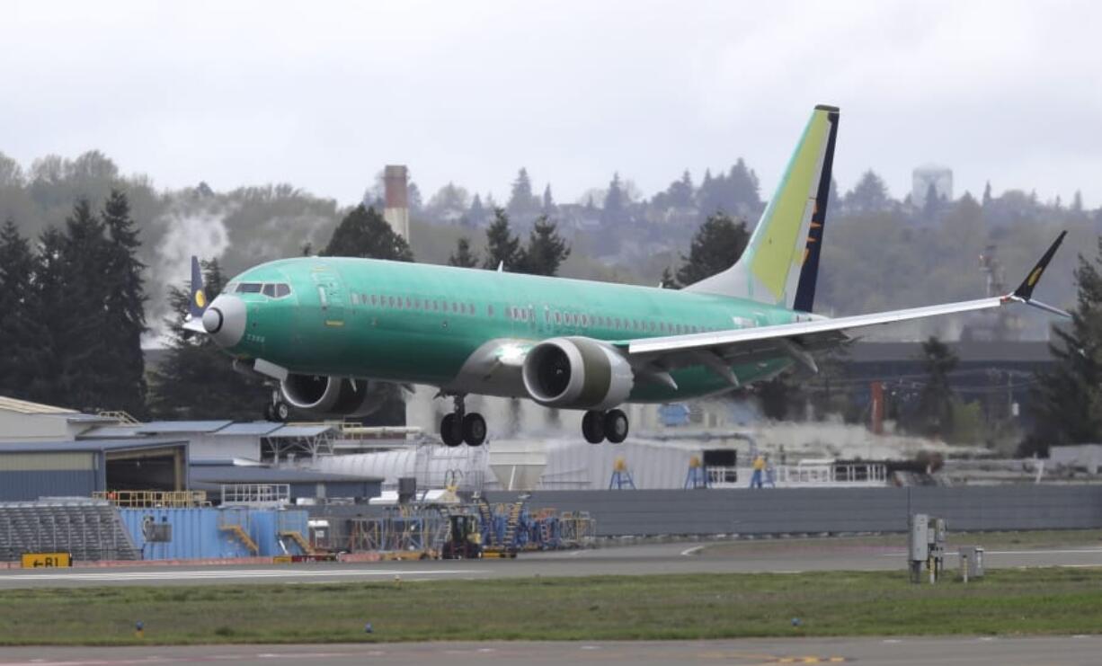 A Boeing 737 MAX 8 airplane being built for India-based Jet Airways lands following a test flight at Boeing Field in Seattle.