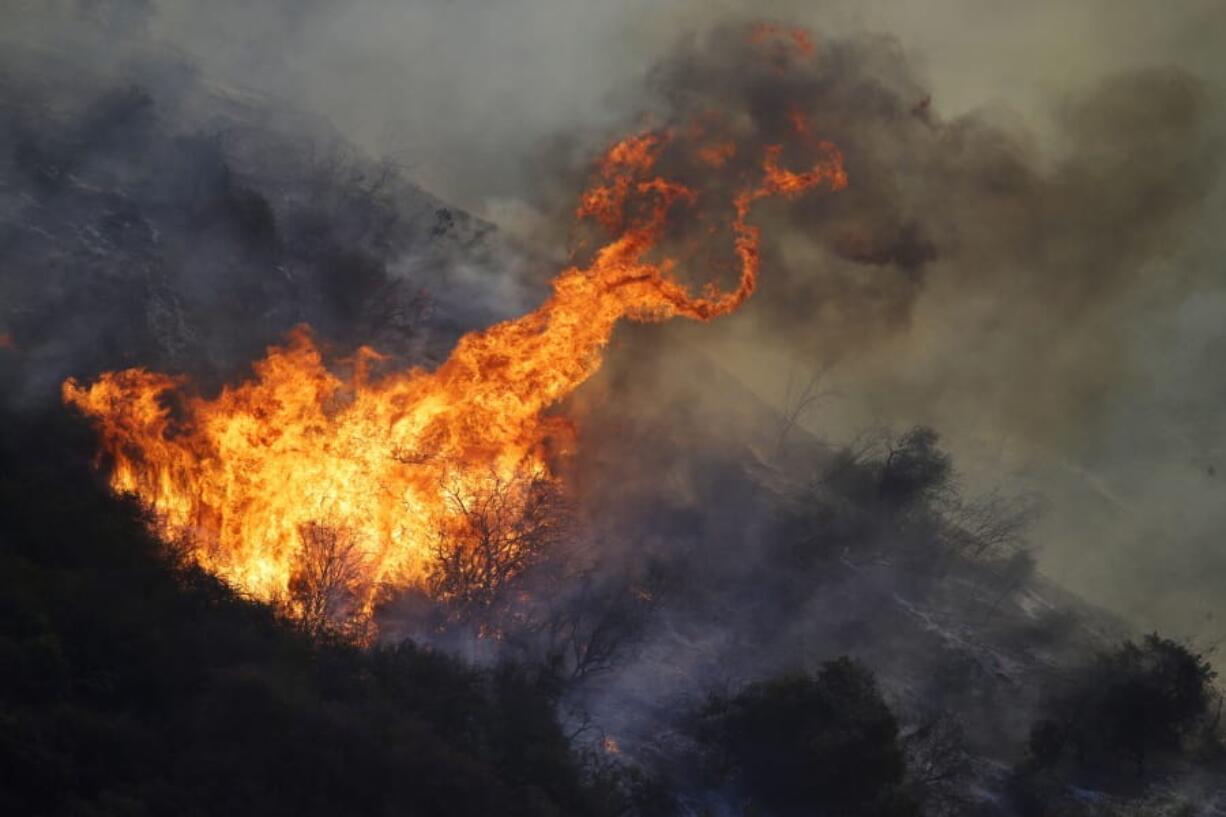 The Getty fire burns on Mandeville Canyon Monday, Oct. 28, 2019, in Los Angeles.