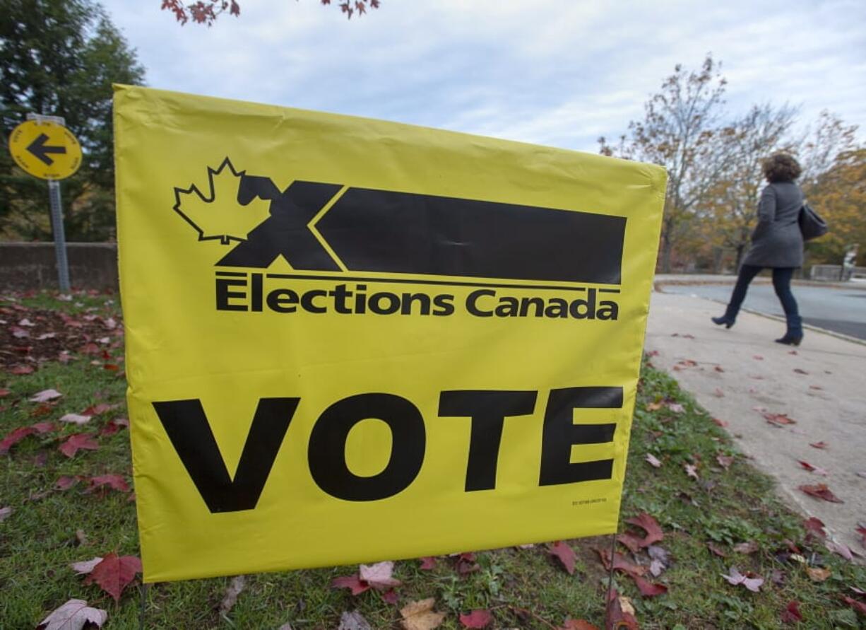 A voter heads to cast their vote in Canada&#039;s federal election at the Fairbanks Interpretation Centre in Dartmouth, Nova Scotia, Monday, Oct. 21, 2019.