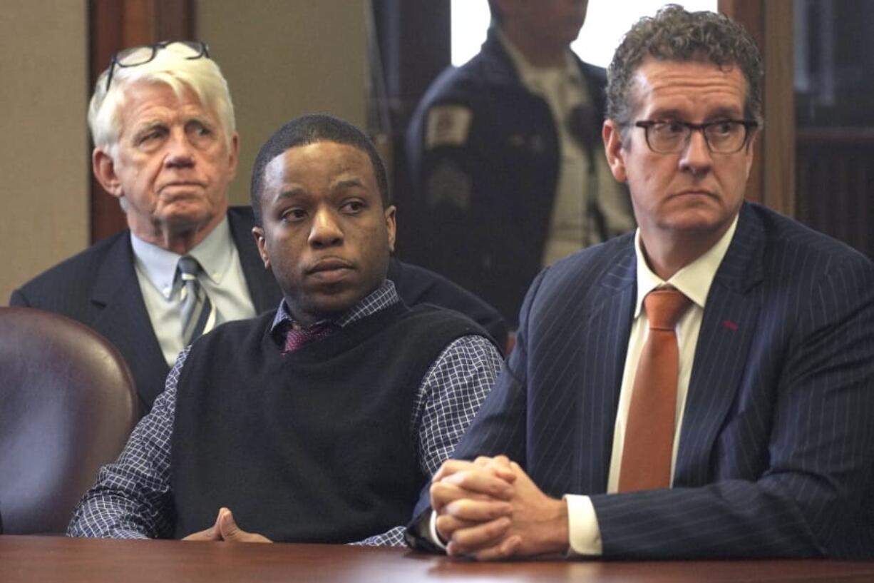 Corey Morgan, center, is accompanied by his attorneys as he is found guilty of first-degree murder for the 2015 slaying of 9-year-old Tyshawn Lee, Friday, Oct. 4, 2019, in Chicago. (E. Jason Wambsgans/Chicago Tribune via AP, Pool) (E.