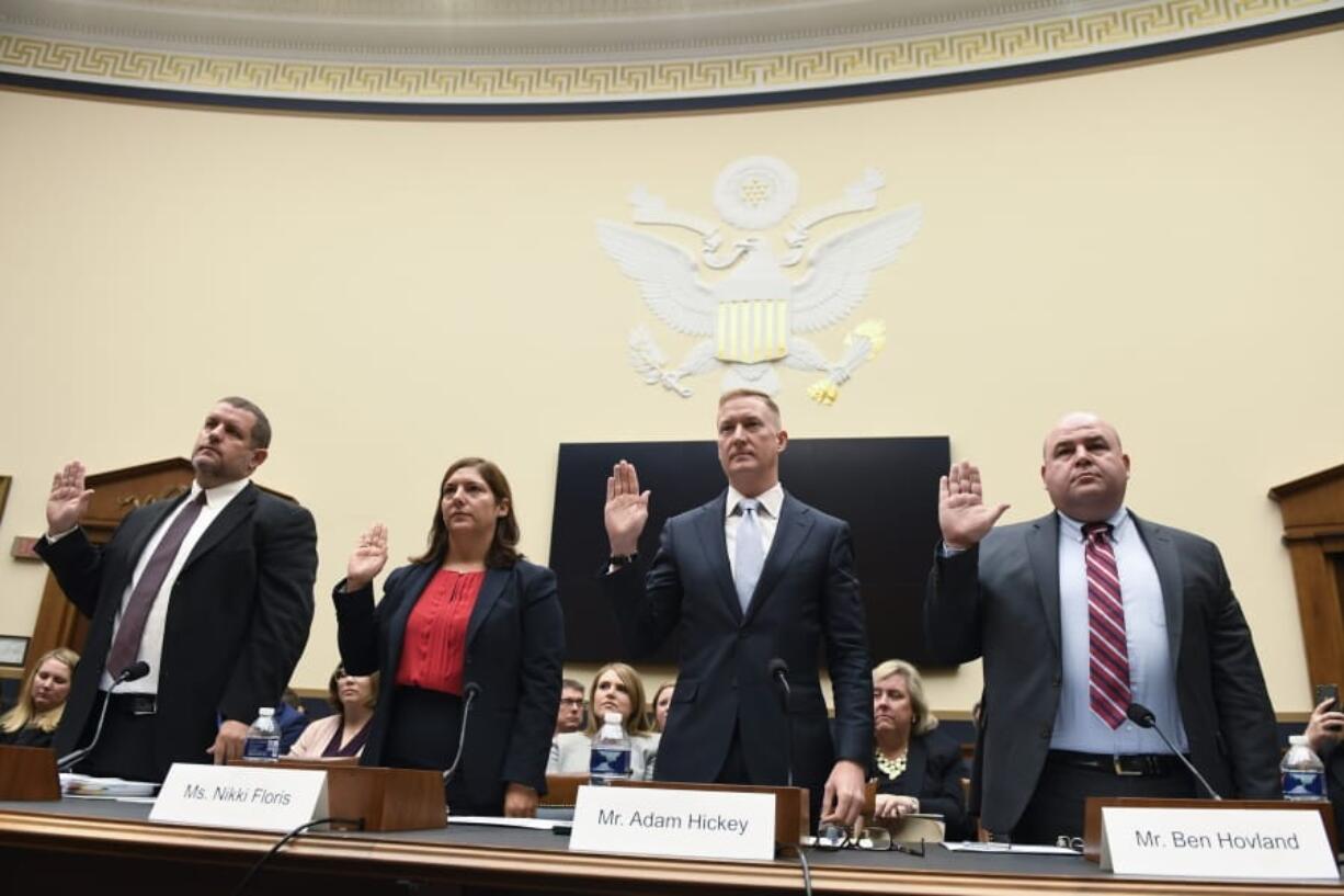 Senior Cybersecurity Advisor at the Department of Homeland Security Matthew Masterson, left, Deputy Assistant Director for Counterterrorism at the FBI Nikki Flores, second from left, Deputy Assistant Attorney General for National Security Adam Hickey, second from right, and Vice Chair at the U.S. Election Assistance Commission Ben Hoveland, right, are sworn in to testify before the House Judiciary Committee hearing on Capitol Hill in Washington, Tuesday, Oct. 22, 2019, on election security.