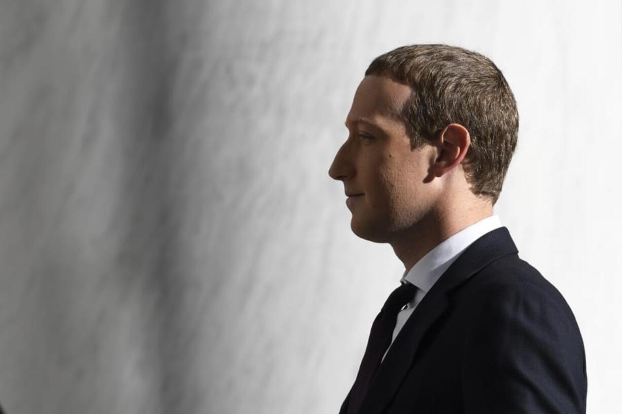 Facebook Chief Executive Officer Mark Zuckerberg arrives for a hearing before the House Financial Services Committee on Capitol Hill in Washington, Wednesday, Oct. 23, 2019, to discuss his plans for the new cryptocurrency Libra.