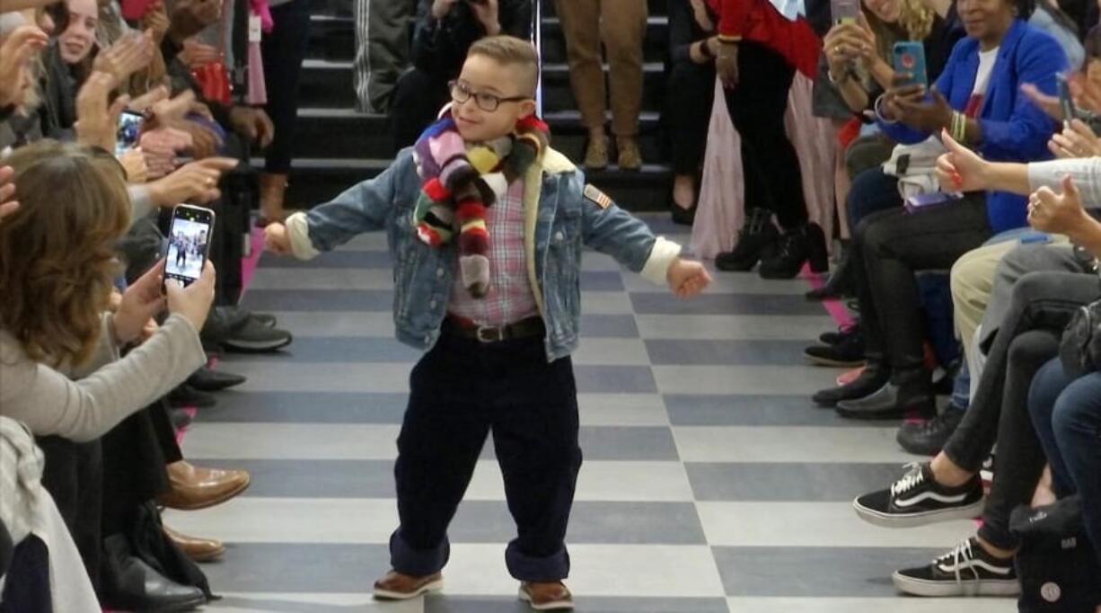 This image from video taken on Wednesday, Oct. 16, 2019 shows a boy participating in the 2nd annual &quot;Gigi&#039;s Playhouse Fashion Show&quot; in New York.  Gigi&#039;s Playhouse is an education and achievement center that prepares young people with Down syndrome to engage more fully in their homes, schools and communities.