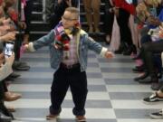 This image from video taken on Wednesday, Oct. 16, 2019 shows a boy participating in the 2nd annual &quot;Gigi&#039;s Playhouse Fashion Show&quot; in New York.  Gigi&#039;s Playhouse is an education and achievement center that prepares young people with Down syndrome to engage more fully in their homes, schools and communities.